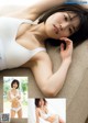 A woman in a white underwear laying on a couch.